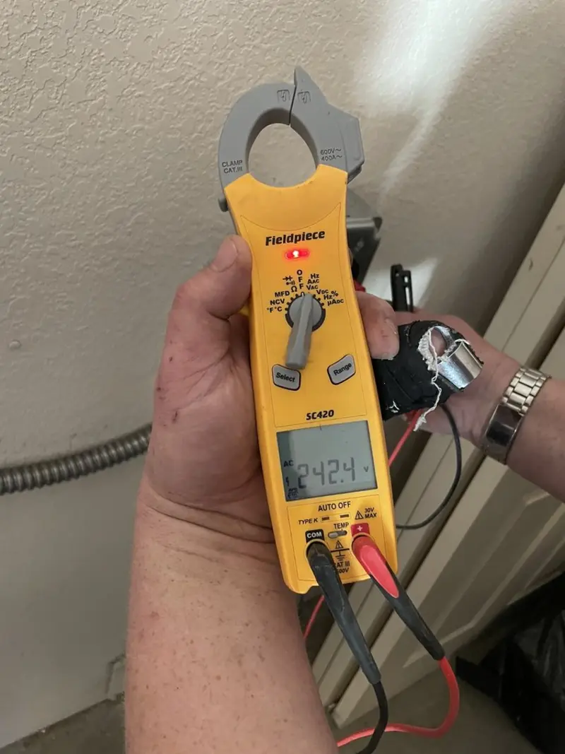 Voltage testing with clamp meter during Outlet Installation in Mayville